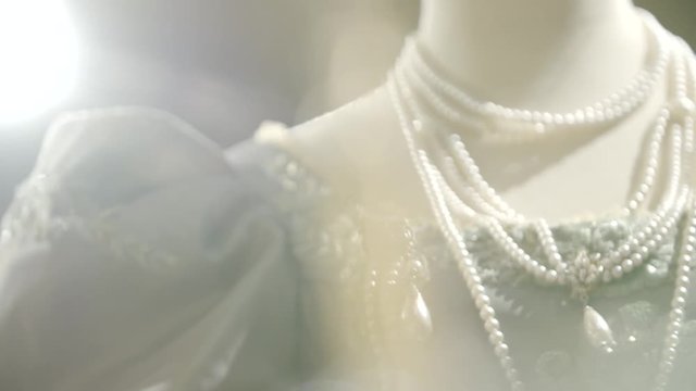 Antique dress details slow motion shot on tailors mannequin.