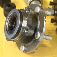 Automotive parts - close up new car wheel hub with bolt pins