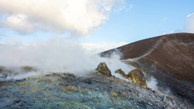 Hikers on the crater of Vulcano with sulfur fumaroles, Aeolian Islands