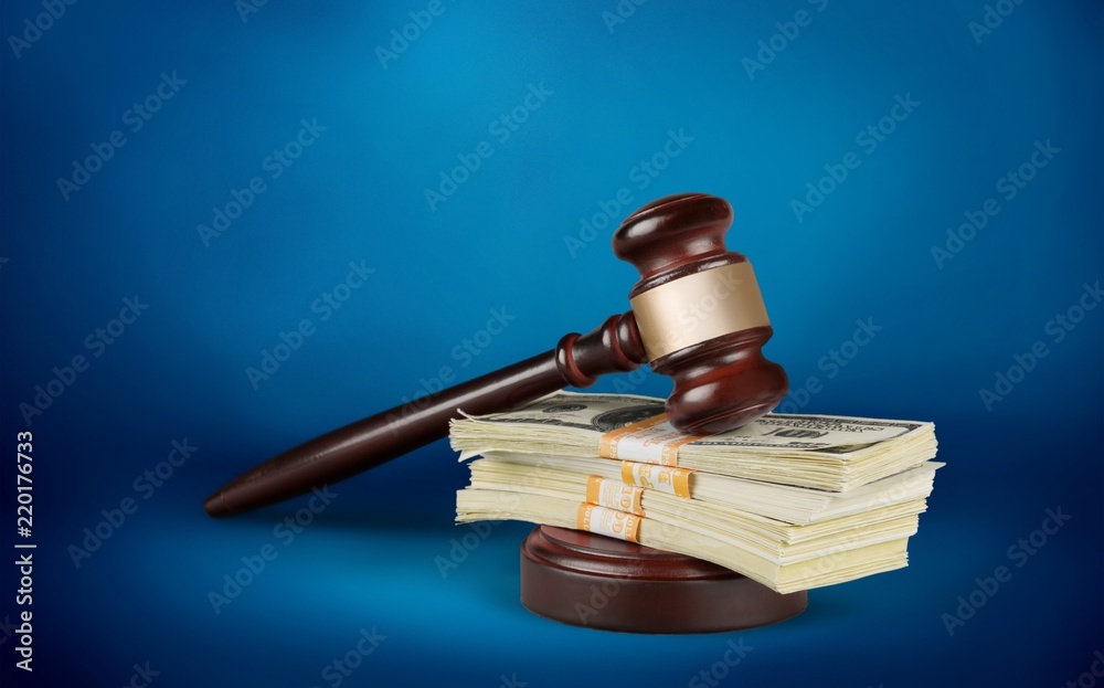 Wall mural Wooden gavel with money, close-up view