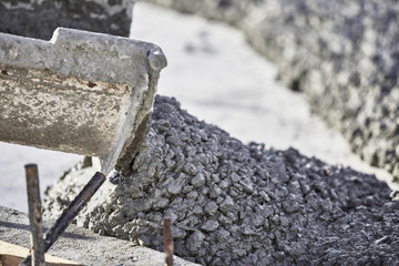 Wet Cement pouring out of cement truck chute