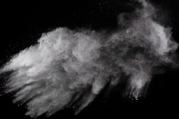 White powder explosion on white background. Colored cloud. Colorful dust explode. Paint Holi.