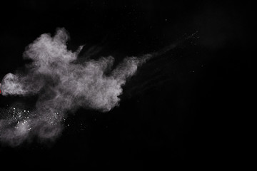 White powder explosion on white background. Colored cloud. Colorful dust explode. Paint Holi.