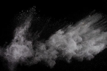 White powder explosion on white background. Colored cloud. Colorful dust explode. Paint Holi.