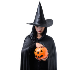 Portrait of woman in black Scary witch halloween costume standing with hat isolated on white background