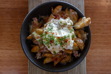 Potato wedges with bacon and sour cream