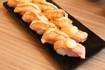 Sushi salmon cheese with cheese top up on dish,Japanese Food