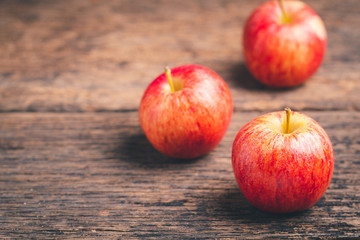 Fresh apples on wood background