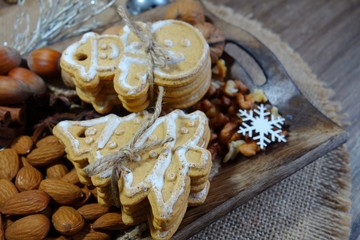 Decorative Christmas cookies, almonds, nuts, cinnamon and anise stars.Christmas sweets and nuts. Christmas time
