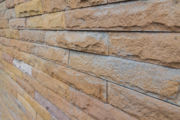 yellow stone wall  made with stone blocks