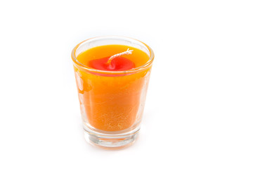 Aroma orange candle in glass isolated