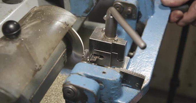 Making duplicate keys for a door lock. Close-up.