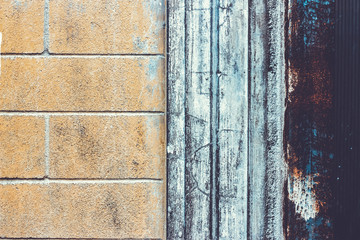 Piece of a ruined brick old wall background.