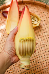 Banana blossom on bamboo tray.