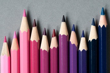 Color pencils isolated on grey background.

