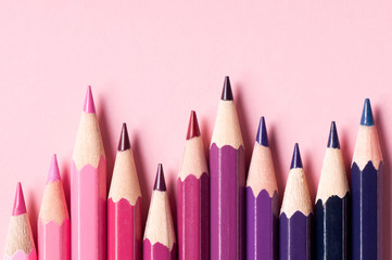 Color pencils isolated on pink background.
