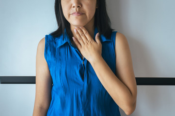 Asian woamn having or symptomatic reflux acids