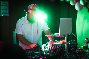 A dj playing music at an event