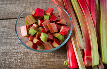 rhubarb stems on wooden surface