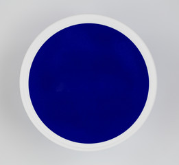 Cosmetic cream container on white background from top view