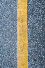 Fototapeta premium Close up of yellow line on the road