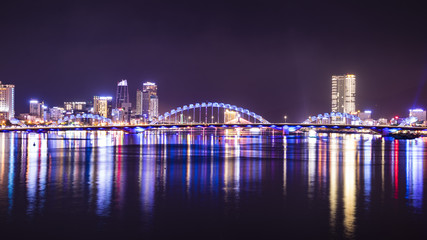 Naklejka premium The dragon bridge at night in the city of Danang, Vietnam.