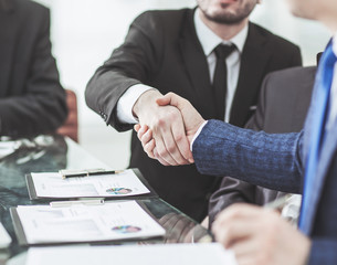  handshake of two lawyers after discussing the terms of a financial contract