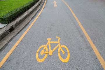 Bike lanes and yellow bike symbol, Bike alley in public park