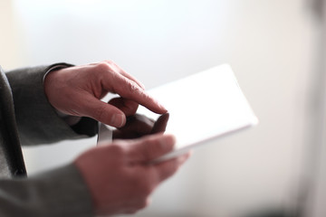 close up.businessman presses on the screen of a digital tablet.photo with copy space