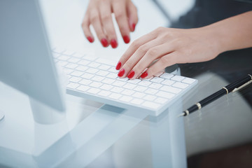 closeup.business woman typing on computer keyboard