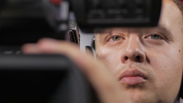 Camera operator working with a cinema broadcast TV camera