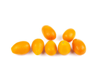 Few kumquat fruits isolated on white background