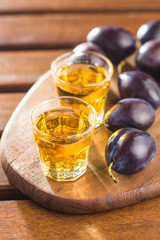 Plum brandy and plums.