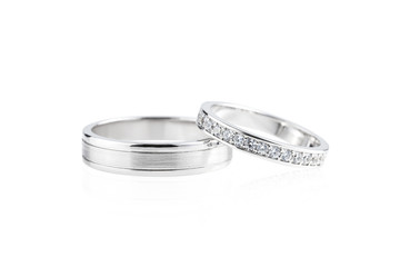 Silver wedding rings isolated on white - obrazy, fototapety, plakaty