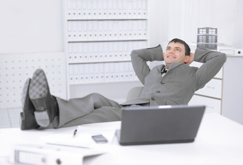 young employee of a company resting on a workplace