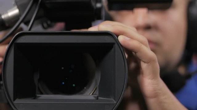 Camera operator working with a cinema broadcast TV camera