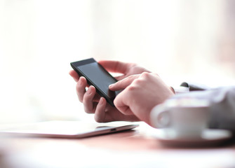 close up.the businessman uses a smartphone. photo with copy space