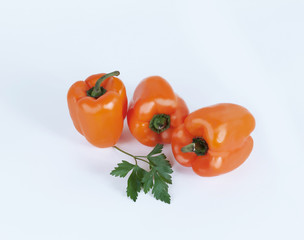 bell pepper and sprig of parsley .isolated on a white background