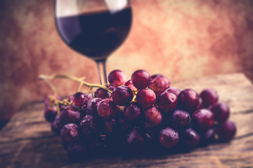 red wine glass and grapes - tilt and shift  style image