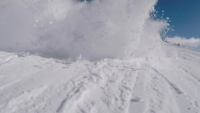 Skis Spraying Snow At Camera