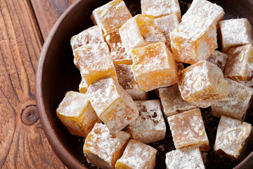 Turkish delight on a wooden table.