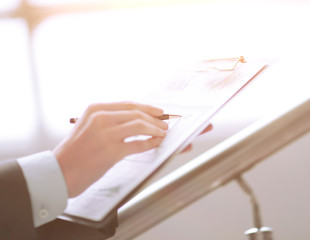 Close up businessman working with graph data at office