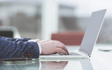successful businessman working on laptop in the workplace.
