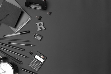 Concept back to school watch chalk line cookies stationery on black background.