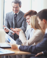 Fototapeta premium close up.businessman and business team analyzing financial data. photo with copy space