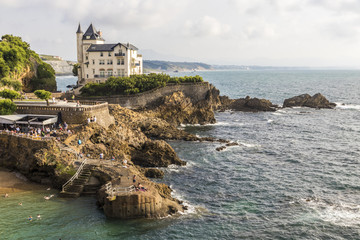 Fototapeta na wymiar Biarritz, France. The Villa Beltza, a 19th century neo-medieval style house on the cliffs of the rocky coastline of Biarritz, French Basque Country