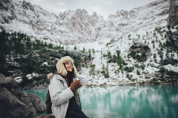 Naklejka premium Girl tourist in forest with mountains on background. Holiday in South Tyrol, Dolomites, Italy. Europe.