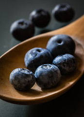 blueberries in a wooden spoon