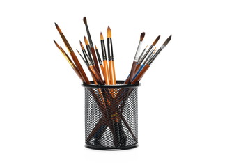 Filled black metal paintbrush holder, container, isolated on white background