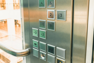 Elevator buttons control panel in modern business building or Mall or shopping center, close up